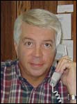 Tim Moore at his desk - your realtor on the beach